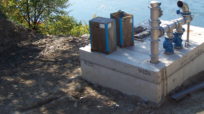 Water Treatment Equipment on a Cement Slab next to a lake