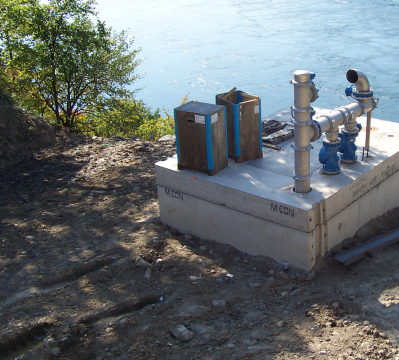 Water Treatment Equipment on a Cement Slab next to a lake